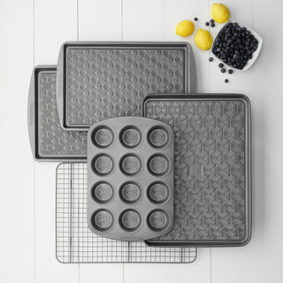 assortment of taste of home baking sheets, cup cake pan and cooling rack
