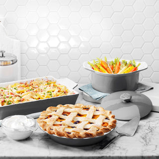 taste of home stoneware 13 x 9-inch baking dish, 2 quart covered casserole dish and pie plate with food