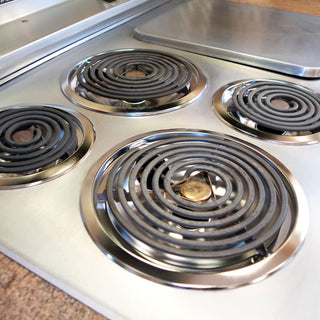 Stainless steel electric stove top with four coil burners with new Style B Chrome Plated Drip Bowls