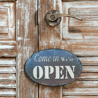 Come in we are open sign on door