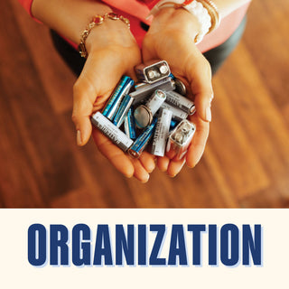 Organization - a person holding a collection of batteries in their hands