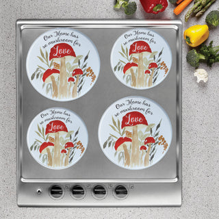 mushroom love burner covers on stainless steel stove with gray speckled counter
