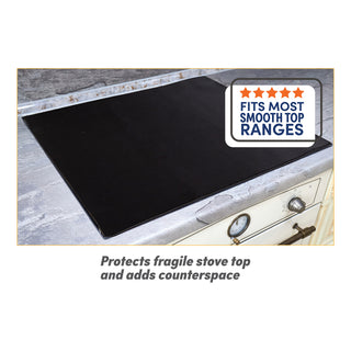 Black stove top cover on a stovetop with text indicating it fits most smooth top ranges and protects fragile stove tops.