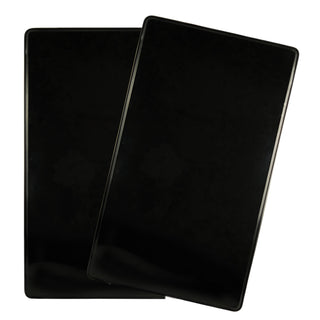 overhead view of two rectangle gas stove black burner covers on white background