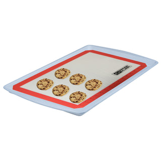 Silicone baking mat with cookies on a white background