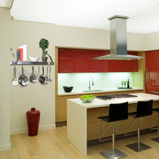 stainless steel shelf pot rack on wall in kitchen