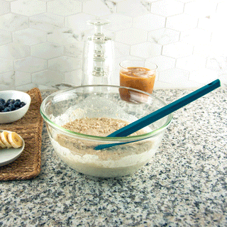 Gif of sea green silicone taste of home spatula mixing pancake batter