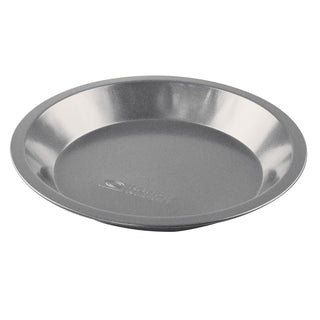 nonstick metal pie pan at an angle on white background