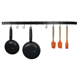 black expandable pot rack at full expansion with cookware and gadgets hanging