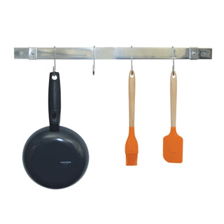 expanding stainless steel  pot rack at shortest expansion with a fry pan, a spatula and a basting brush hanging