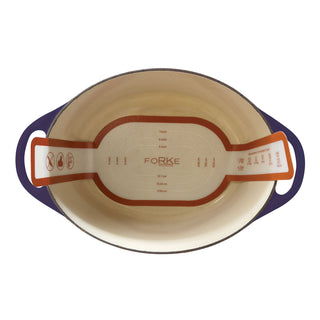 oval silicone liner inside a cast iron dutch oven on white background