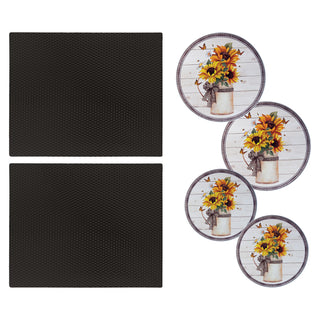 Two 14 x 17 nonslip countertop mats in matte black and 4 pack decorative round burner covers with sunflowers in pot on white weathered wood background on white background.