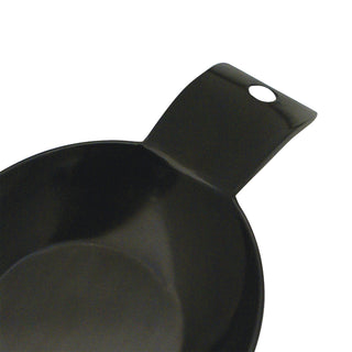 close up of handle of black melamine spoon rest on white background